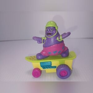 1992 McDonald's Grimace Skateboard Pink Shorts Green Helmet Toy.